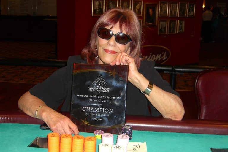 Barbara Enright holding hall of fame plaque