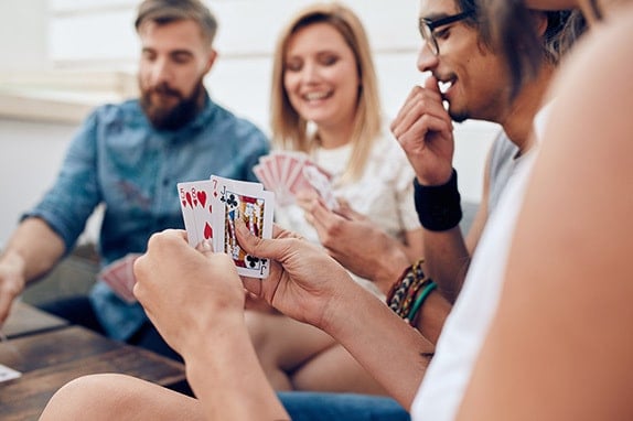 group of friends playing badugi